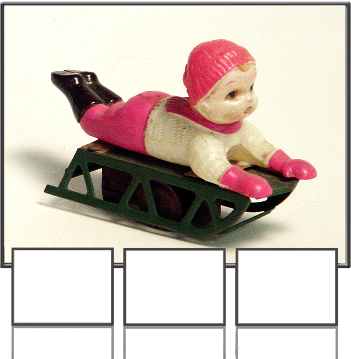Child lying on snow sled made in occupied Japan 1950s
